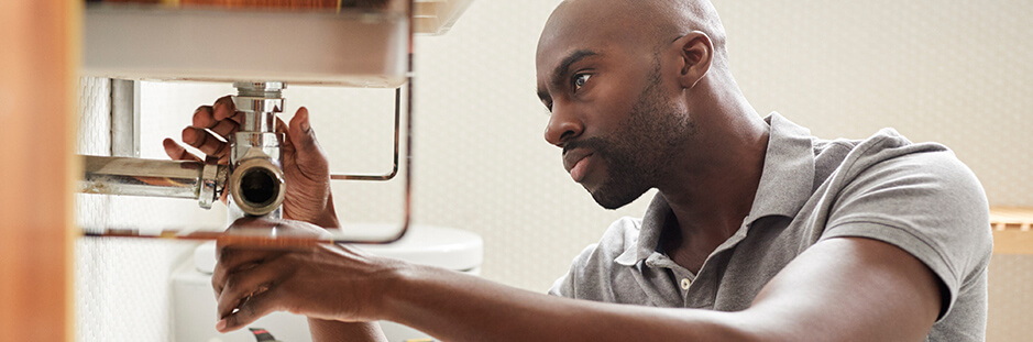 Handyman working on door